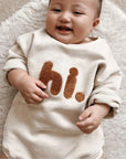 - “Hi.” Embroidered Long Sleeve Baby Romper Baby Stork
