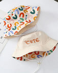 - Reversible Cotton Bucket Hat – “Cute” Print Baby Stork