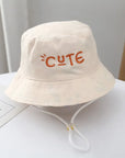 - Reversible Cotton Bucket Hat – “Cute” Print Baby Stork