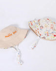 - Reversible Cotton Bucket Hat – “Cute” Print Baby Stork