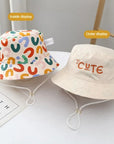 - Reversible Cotton Bucket Hat – “Cute” Print Baby Stork