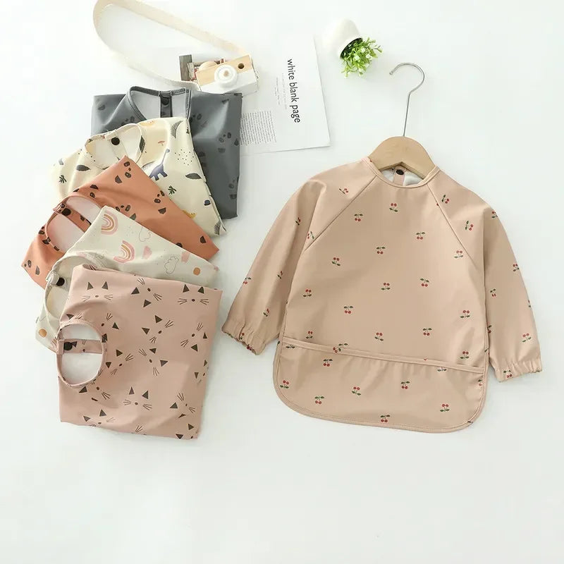 - Patterned Baby Smock Bib – Waterproof Long Sleeve Feeding & Playtime Bib | Baby Stork Baby Stork Bibs