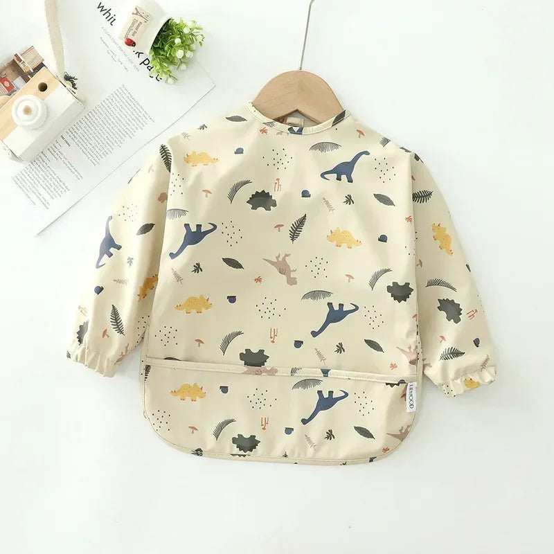 Dinosaur - Patterned Baby Smock Bib – Waterproof Long Sleeve Feeding & Playtime Bib | Baby Stork Baby Stork Bibs