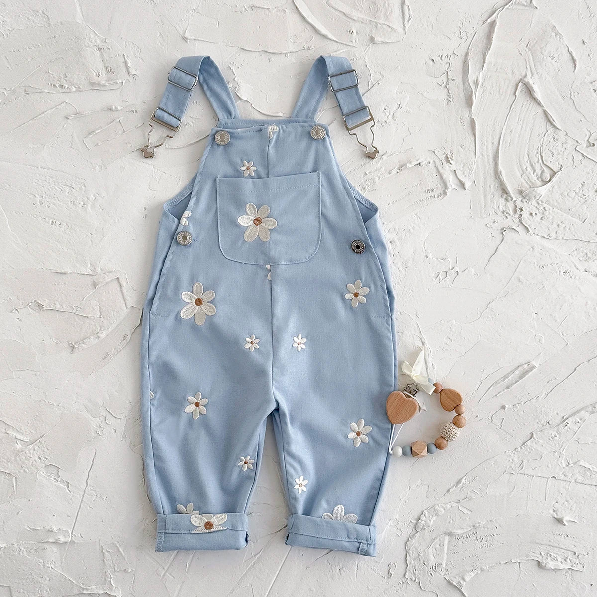 - Daisy Embroidered Overalls – Soft Blue Cotton Baby Stork