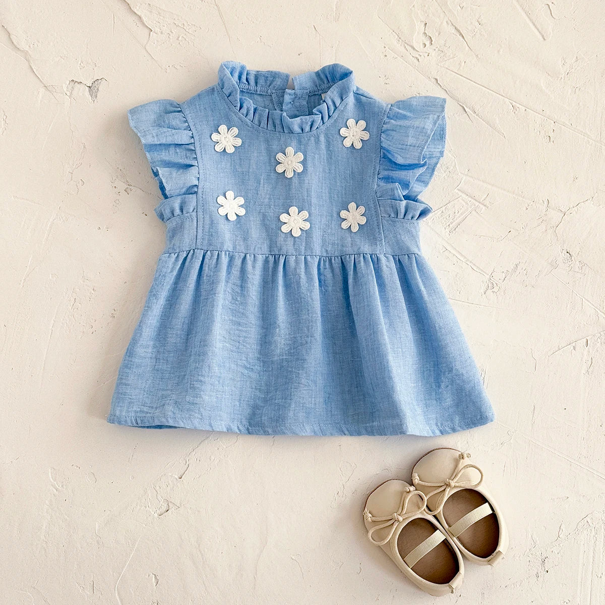 - Blue Daisy Flutter Dress – Sweet Ruffle Detail Baby Stork