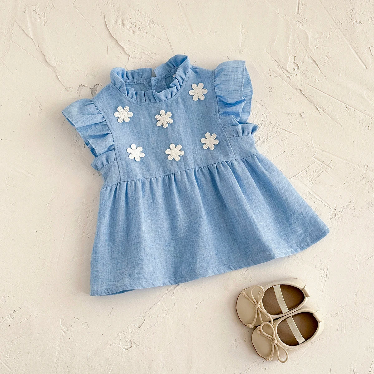 - Blue Daisy Flutter Dress – Sweet Ruffle Detail Baby Stork