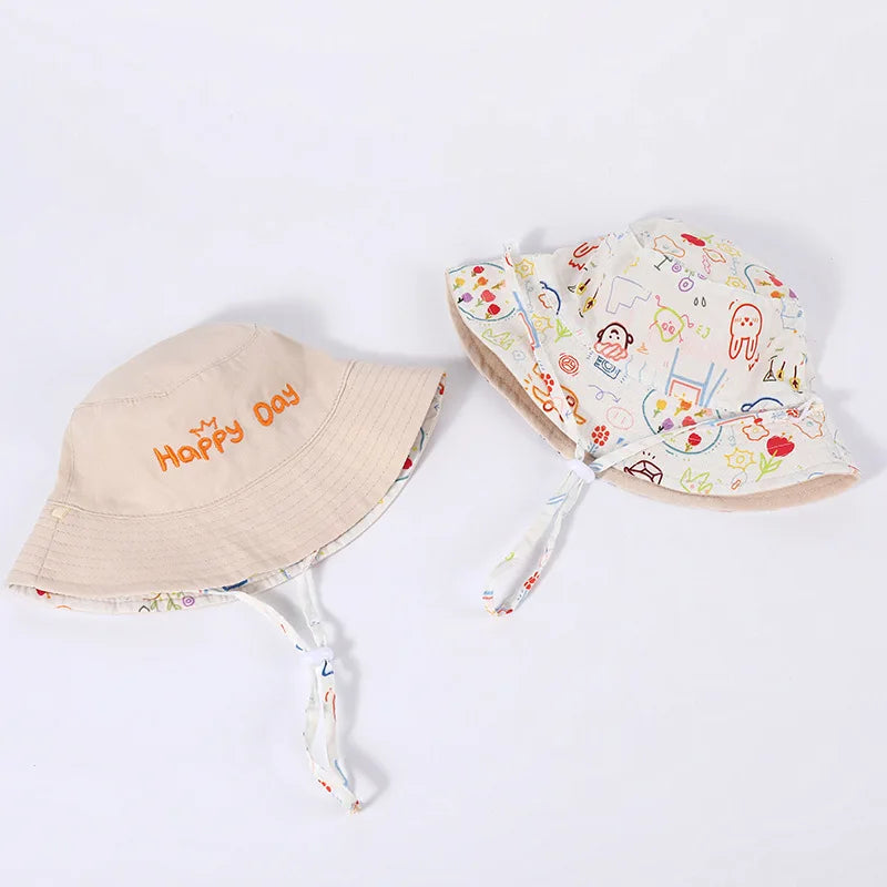 - Reversible Cotton Bucket Hat – “Cute” Print Baby Stork