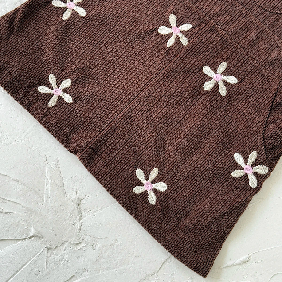 - Chocolate Corduroy Overall Dress – Embroidered Daisy Pinafore Baby Stork