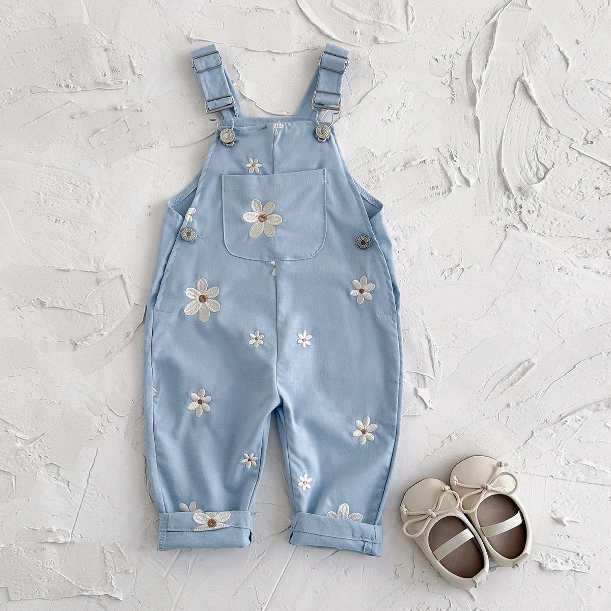 - Daisy Embroidered Overalls – Soft Blue Cotton Baby Stork