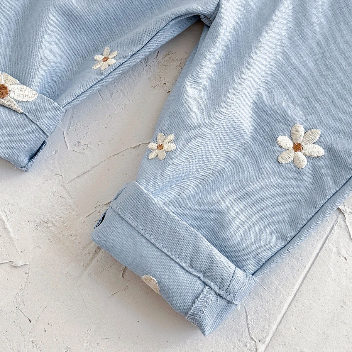 - Daisy Embroidered Overalls – Soft Blue Cotton Baby Stork
