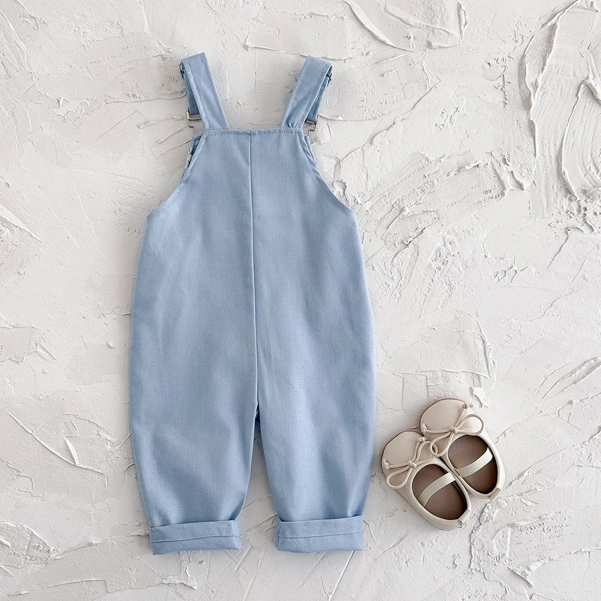- Daisy Embroidered Overalls – Soft Blue Cotton Baby Stork