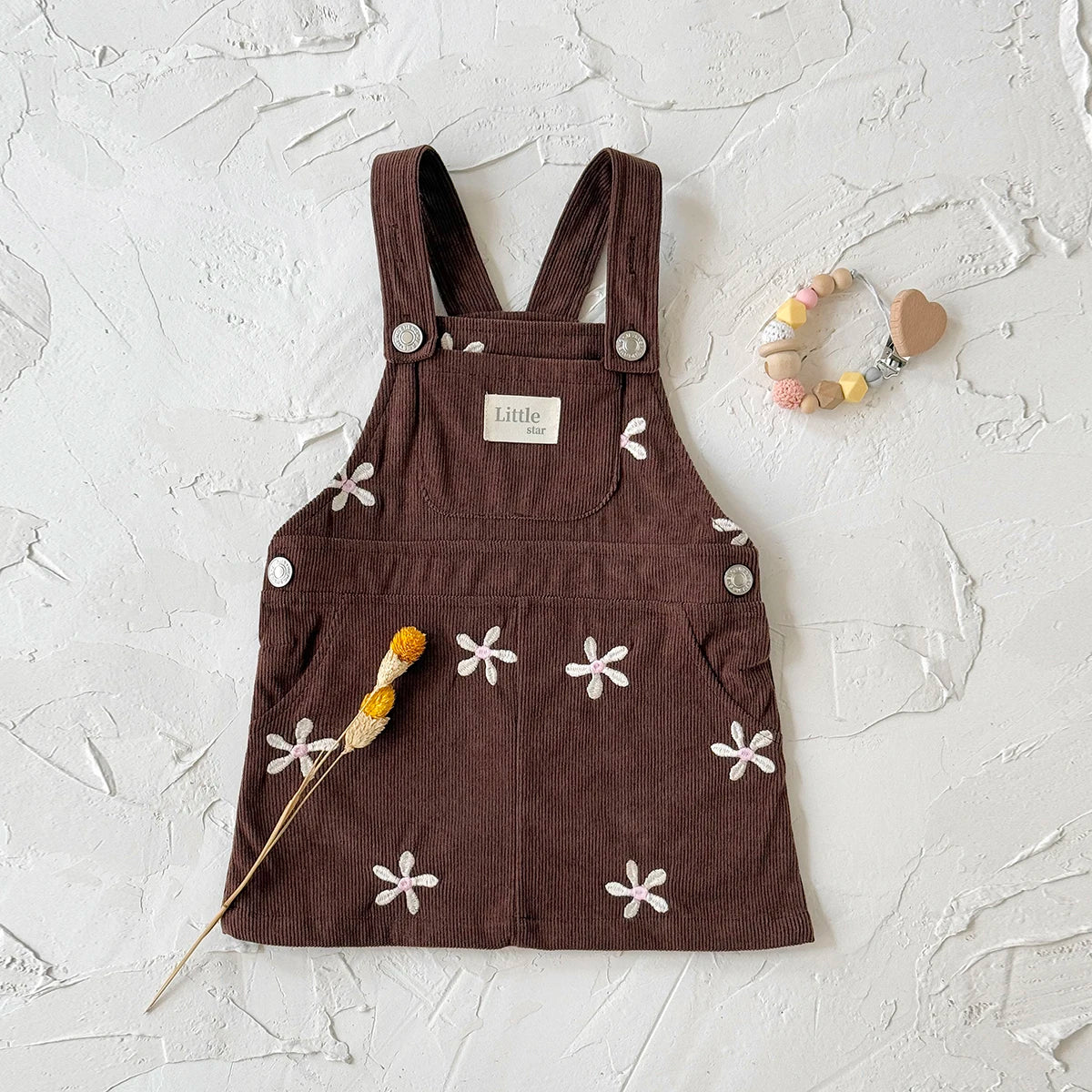 - Chocolate Corduroy Overall Dress – Embroidered Daisy Pinafore Baby Stork